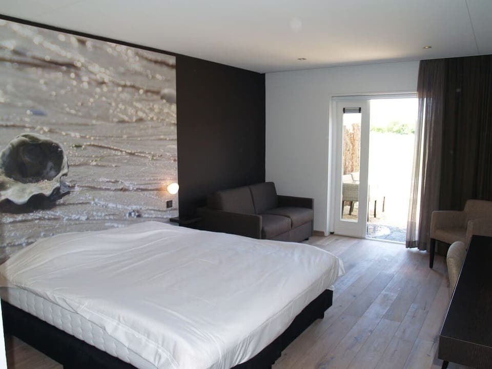 Unit with 1 King bed. Exact unit will be assigned upon arrival. Views, colors, and decor may vary.