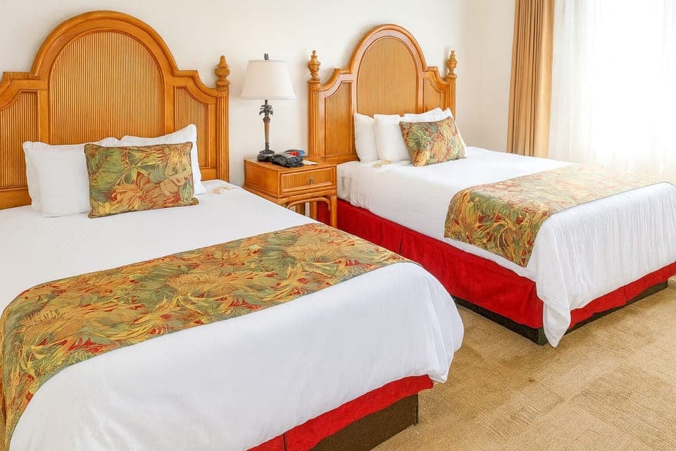 Spread out comfortably with two plush beds and soft lighting.