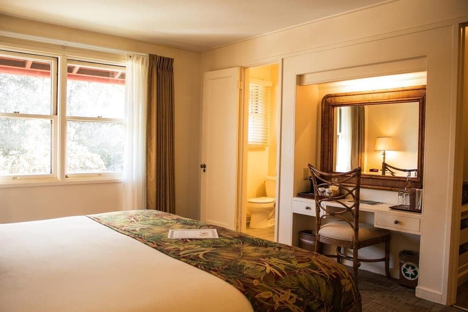 Get ready easily with vanity seating and cozy bedside glow.