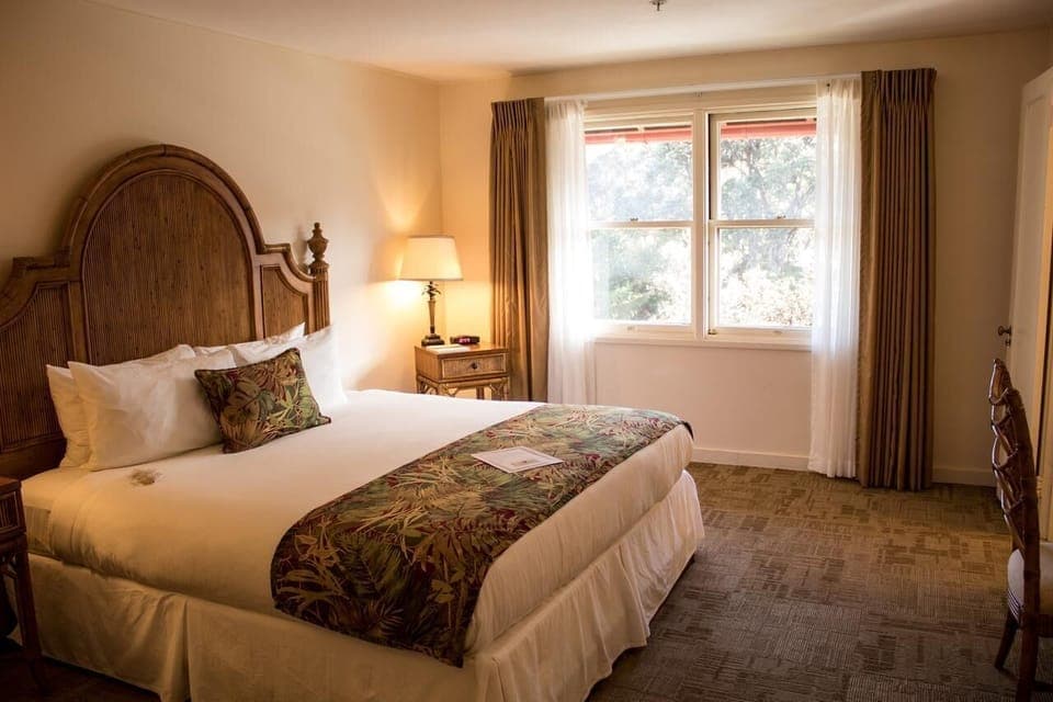 Soak up morning light while lounging in this serene bedroom.