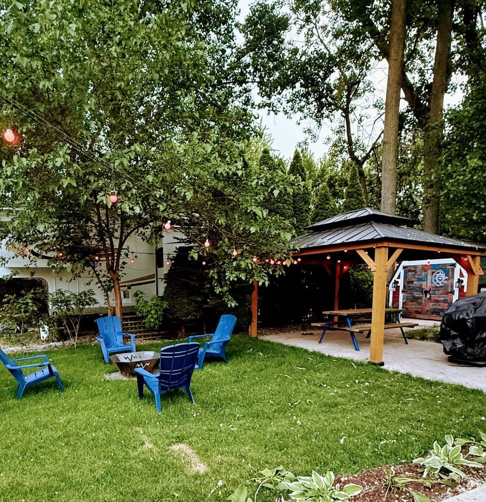 Cozy outdoor fire pit, perfect for evening gatherings, roasting marshmallows, or enjoying the campground ambiance.