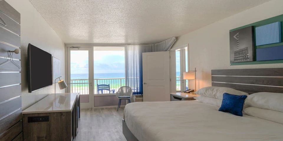 Unit with king bed. Exact unit will be assigned upon arrival. Views, colors, and decor may vary.
