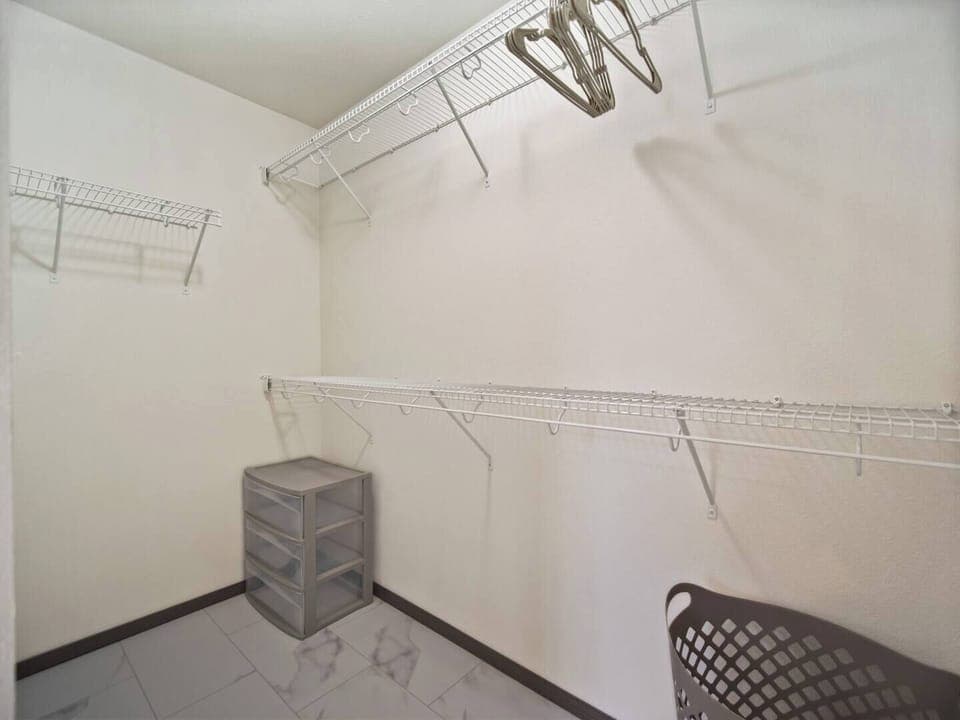 A large walk in closet in the master bathroom has plenty of space for your luggage and clothing. 