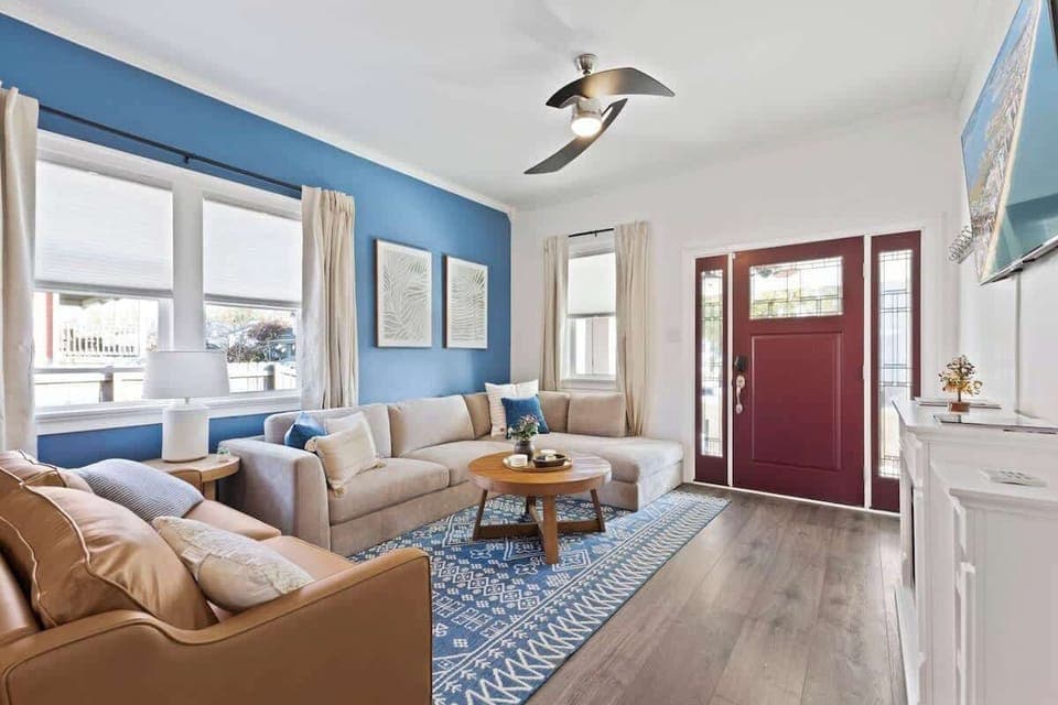 Stylish open-concept living and dining room with natural light and modern décor