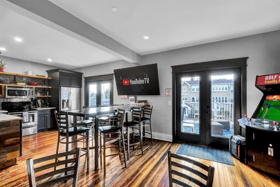 The heart of it all. The open living room/bar/kitchen that opens up to the sky deck. Relax with your friends and family on the huge leather sofa or at the large bar with seating for 9. Watch t