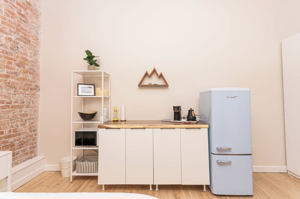 Basic Kitchenette with microwave for reheating meal. Refrigerator and Freezer. 