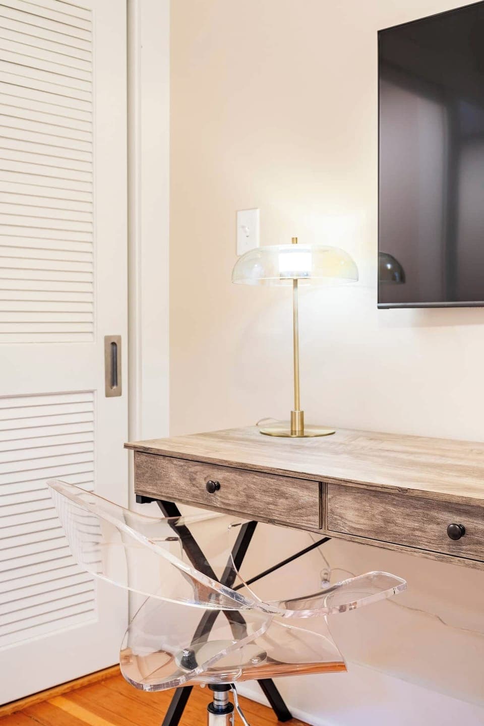 OFFICE / DEN: Has sliding door & dedicated workspace.