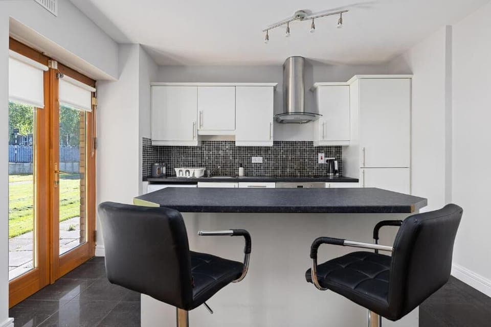 Sunlit kitchen with easy outdoor access.