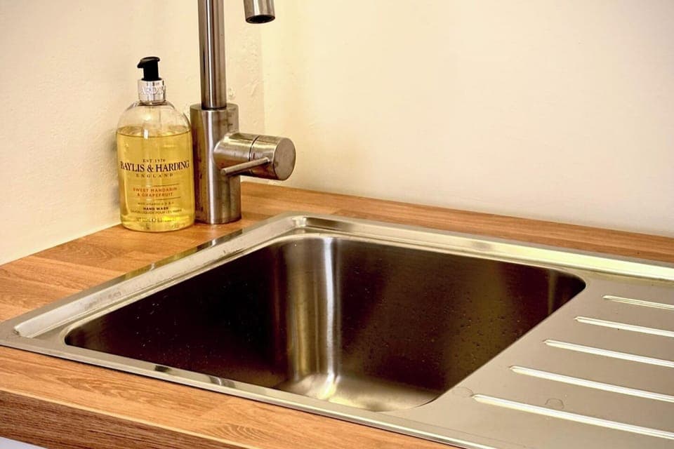 A separate sink area , ideal for tea, coffee and washing up. 