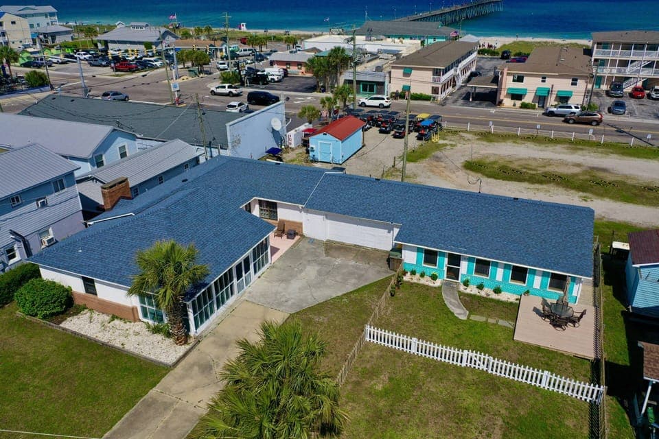 Sea Side by Side is two properties are on the same lot (Lorraine's + Bec's), separated by a garage.