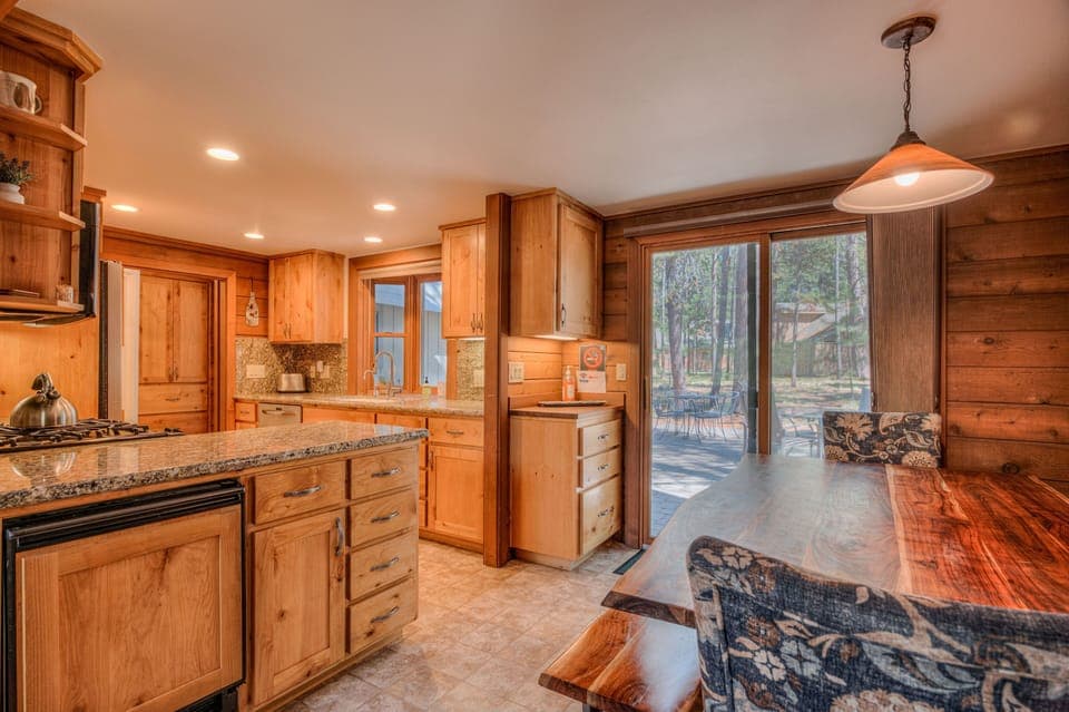 Dining Area, looking into kitchen with access to back deck