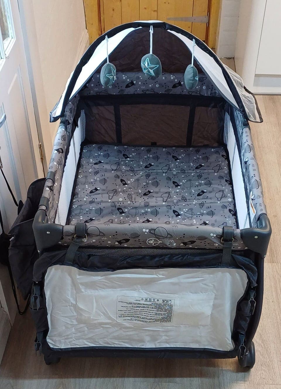 Travel cot over