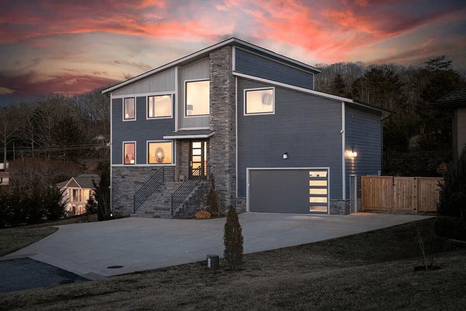 A striking gray exterior with bold lines and modern accents gives this home unmatched curb appeal and a sophisticated architectural presence.