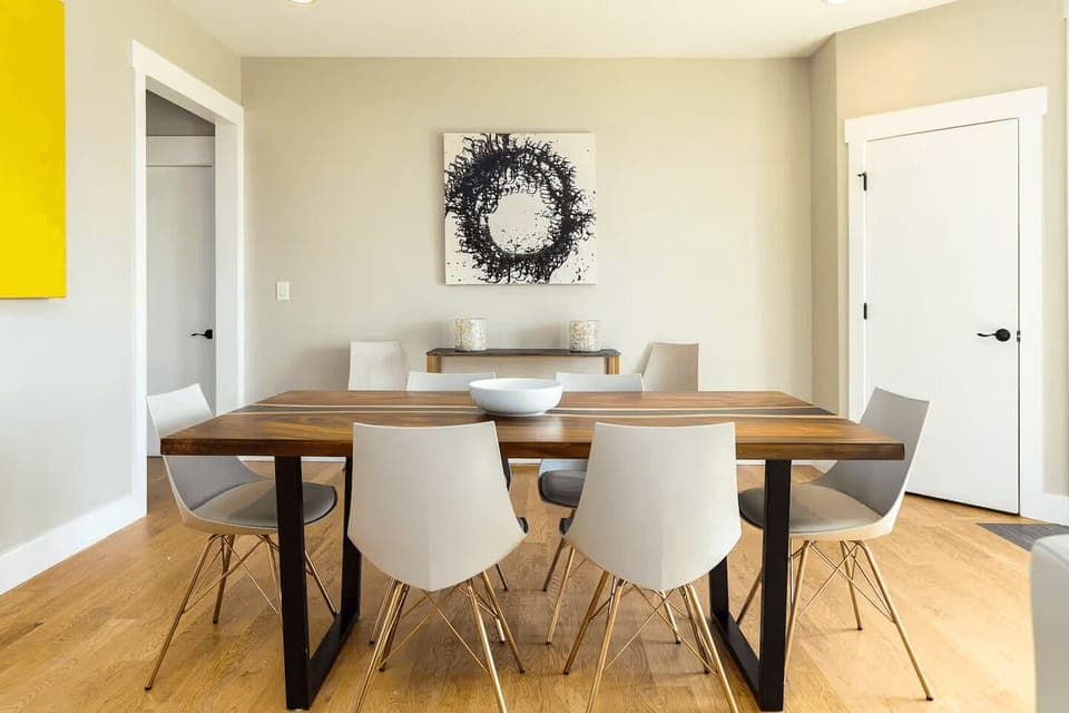 Enjoy meals in this bright, airy dining space that offers plenty of room and charm with modern accents and a warm, welcoming atmosphere.