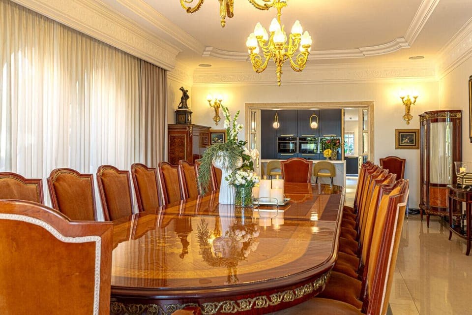 Spacious 16-person dining room connecting the kitchen to the terrace