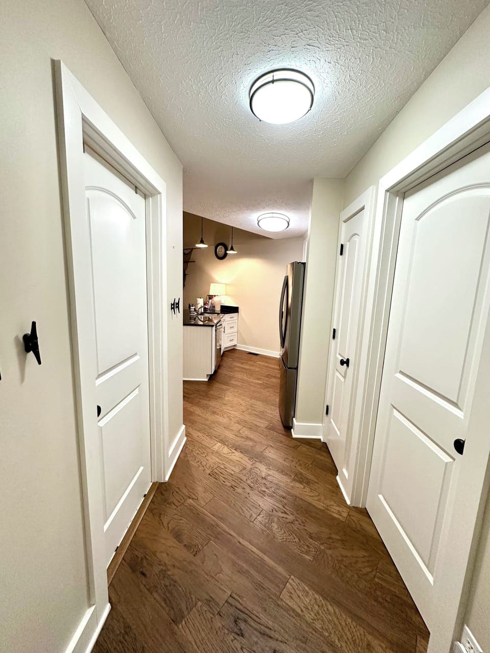 Entrance to condo. Door on right is the 1st bedroom, door on left is a bathroom.