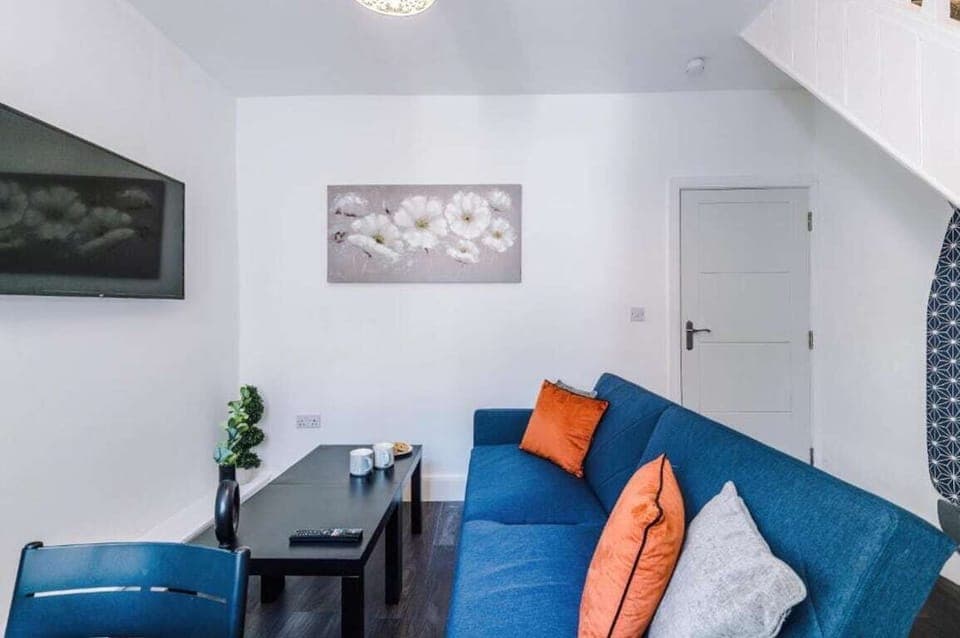 The stylish living area benefitting from a Smart TV with Netflix and a comfortable sofa.