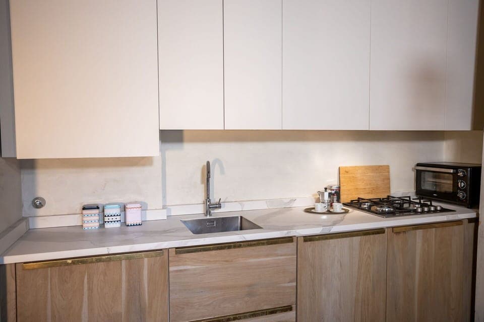 Kitchen, Countertop, Wood, Kitchen Appliance, Interior Design, Cabinetry, Flooring, Major Appliance, Kitchen Sink, Home Appliance