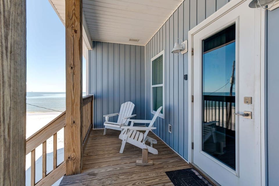 Your private beachfront balcony awaits with comfortable seating and stunning ocean views—perfect for morning coffee or sunset relaxation.