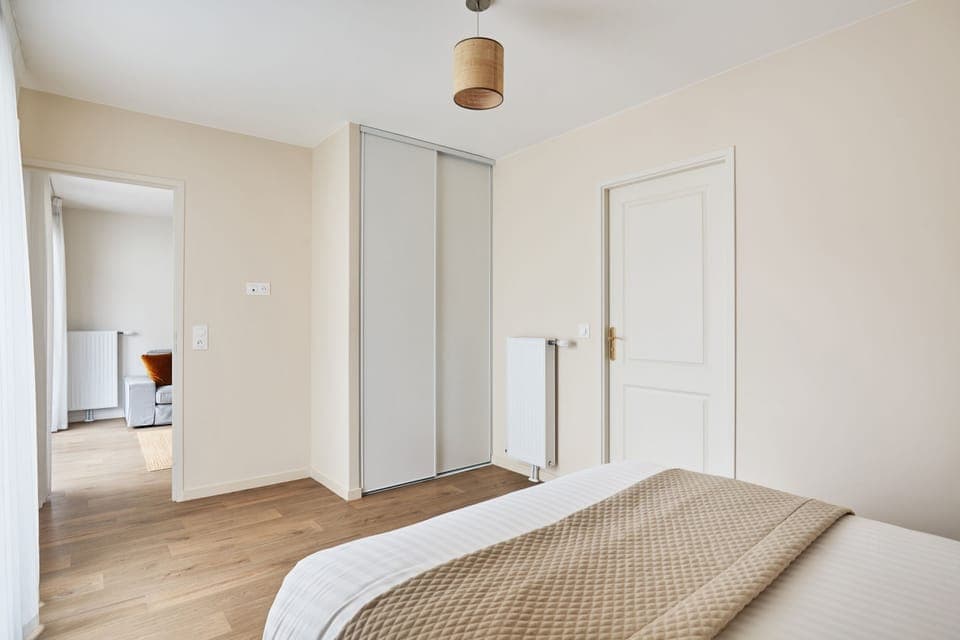 View from the bedroom into the hallway, highlighting the apartment’s accessible and open layout.