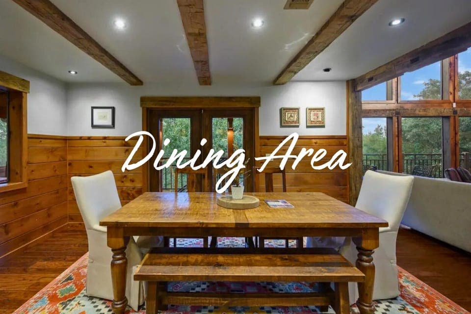 Enjoy memorable meals at this spacious table set against a backdrop of nature.