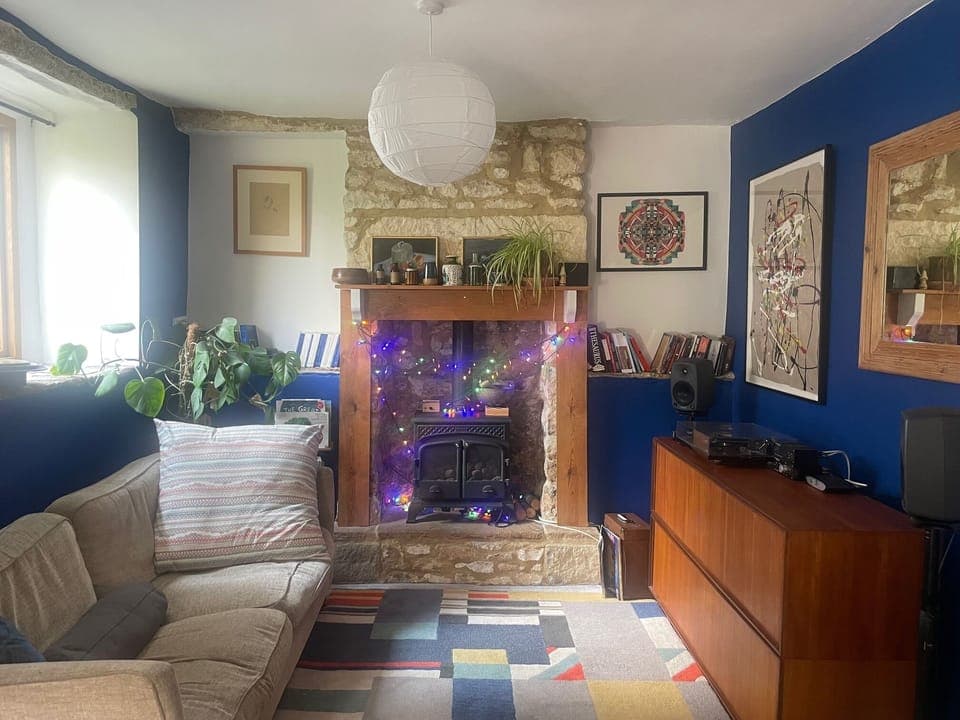 Living room, including gas-burning stove.