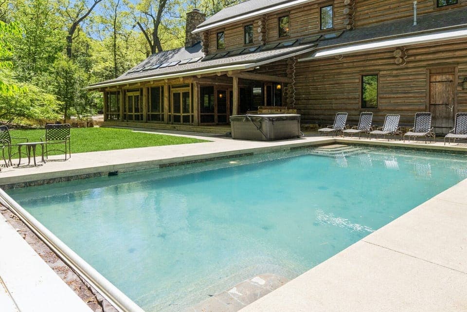 Outdoor oasis with private pool, cozy cabin feel, and nature all around.