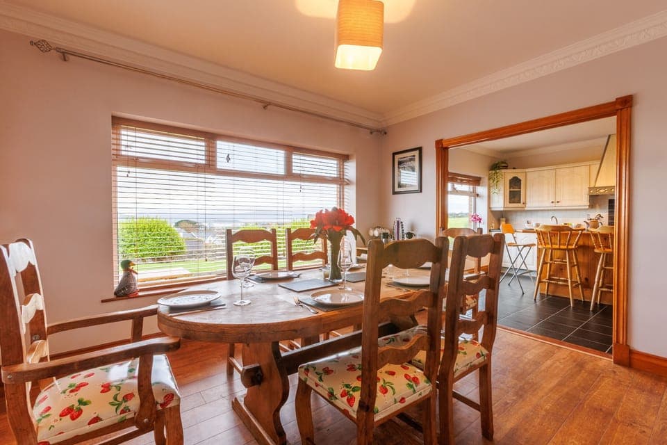 This bright and spacious dining room boasts stunning views while you enjoy a meal