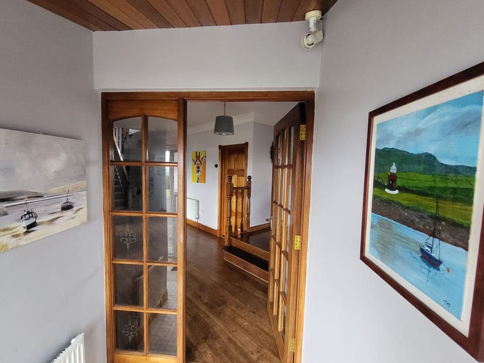 Entry hall to the holiday home furnished with local art