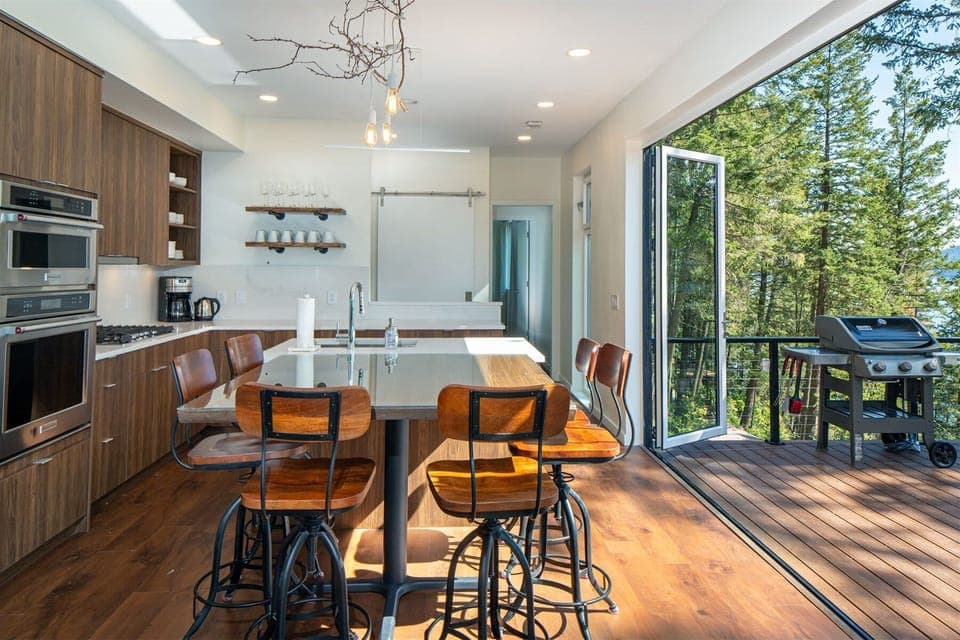 Bring the outdoors in with the accordion style doors that frame the main living area | Main Floor