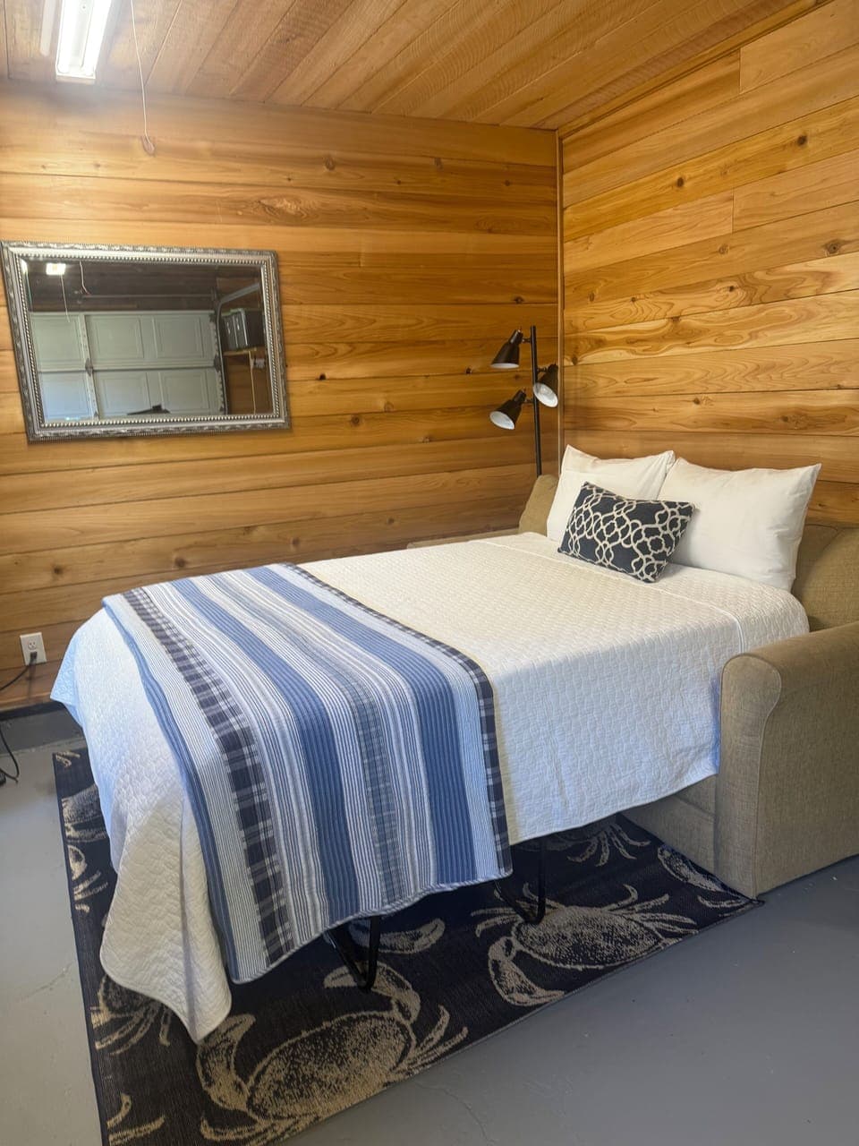 Couch bed in the bonus room/garage