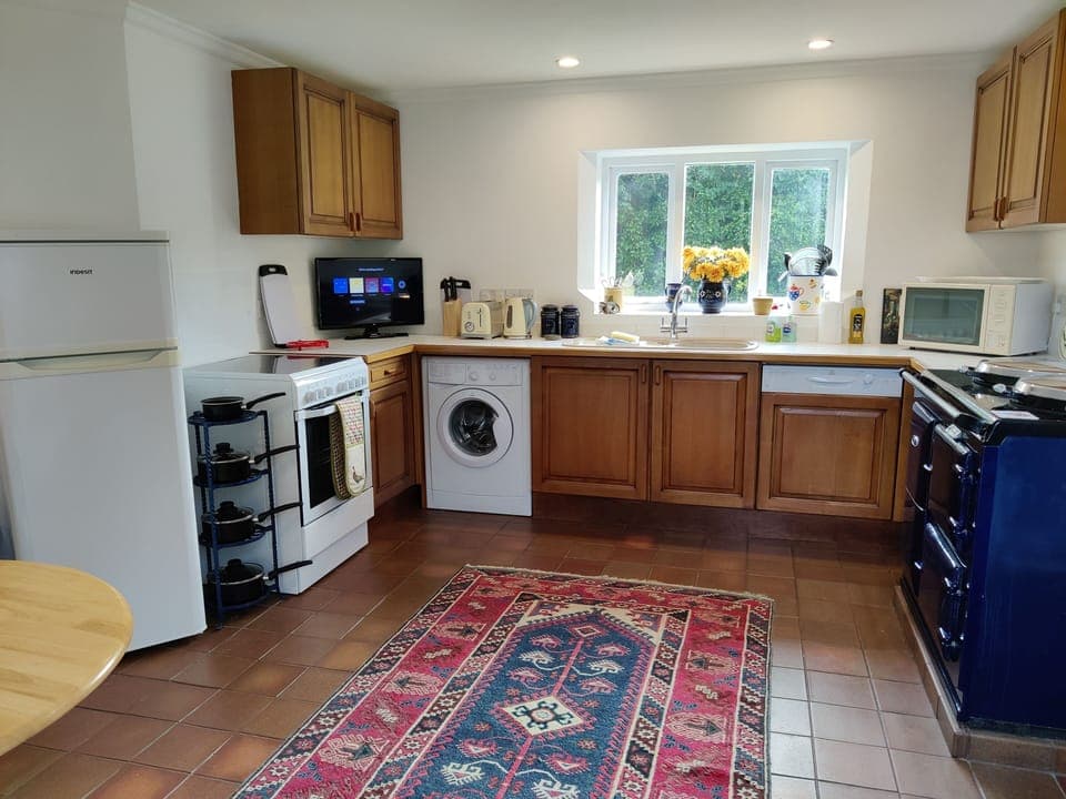 Kitchen with new appliances and AGA. Smart TV with Netflix