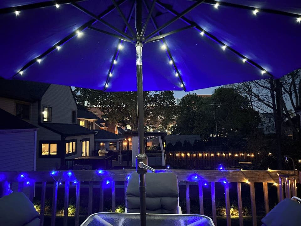 View of the backyard deck lights and the U of M Stadium.