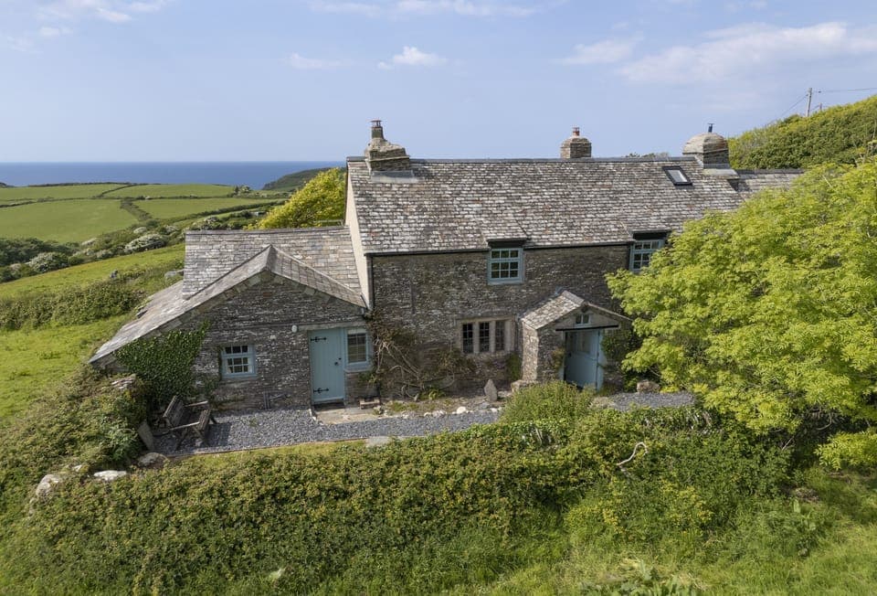 Warmly welcoming you to Besloe, a Grade II Listed cottage, just moments from the sandy shores of Trebarwith Strand