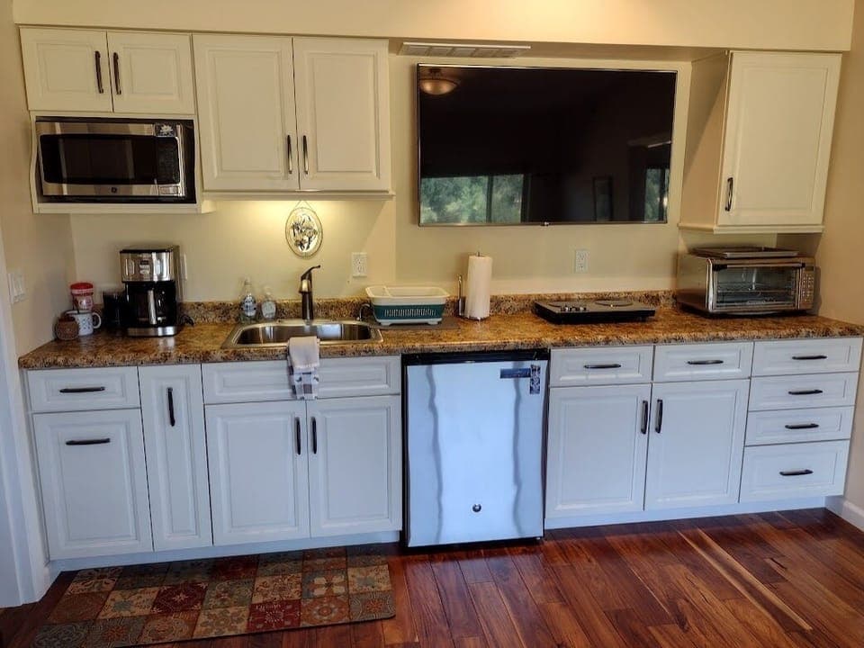 Fully equipped kitchenette and lg. TV in the central room.