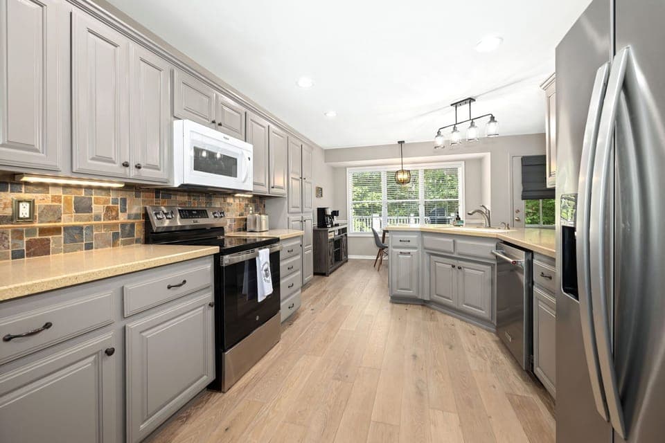 Whether you're preparing delicious meals in the fully equipped kitchen or enjoying a card game at the dining table, the seamless flow of this space ensures everyone can be part of the fun.