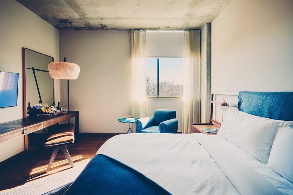 Wake up to soft daylight and a peaceful seating nook.