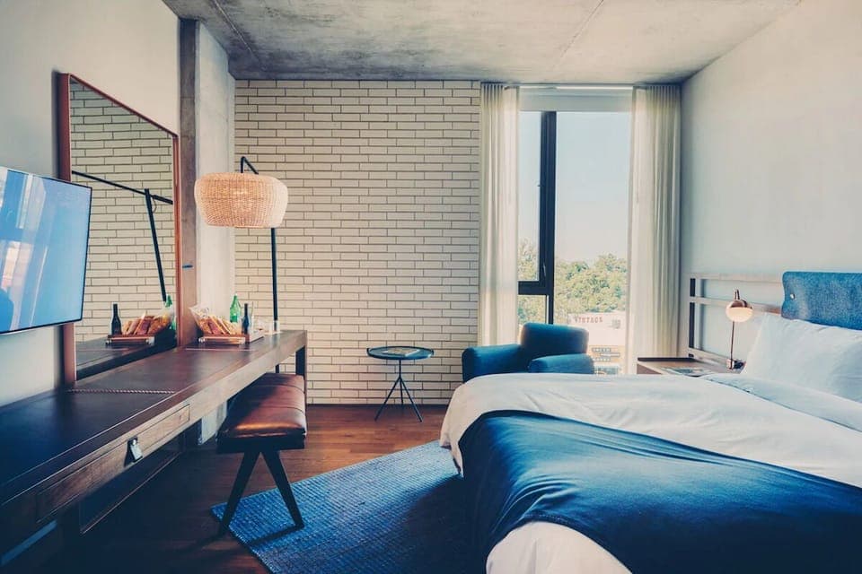 Wake up to soft daylight and a calming city outlook.