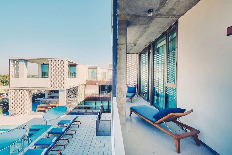 Soak up sunshine beside the pool with balcony-side privacy.