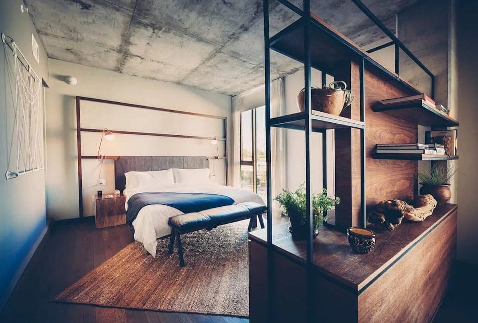 Unwind in crisp linens with calming city-view light.