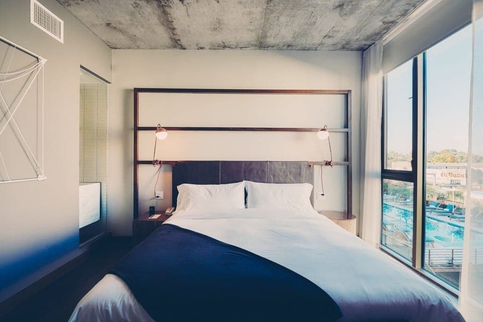 Drift off comfortably beside expansive windows and skyline views.