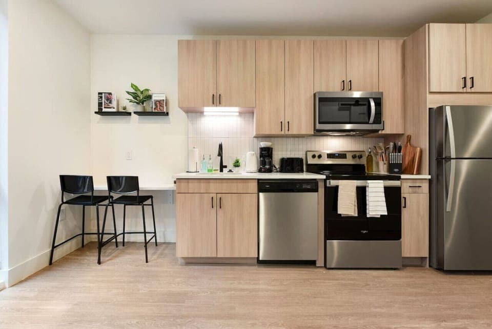 You’ll love the convenience of this fully equipped kitchen, where you can brew coffee, cook meals, or prepare snacks. The cozy layout and warm ambiance make cooking here a delightful part of your stay.