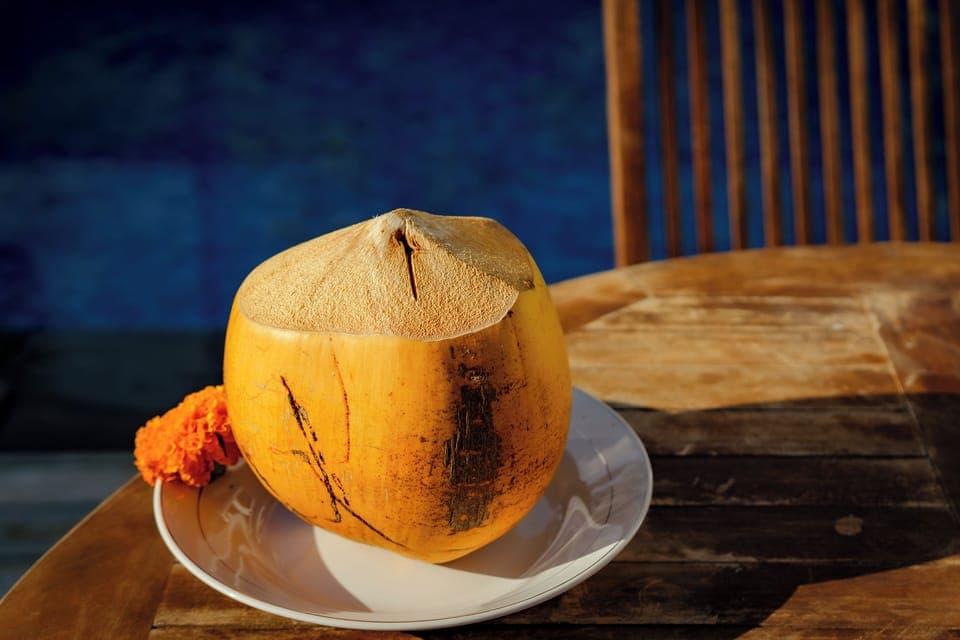 Outdoor seating area with parasol at Vil’latu villa