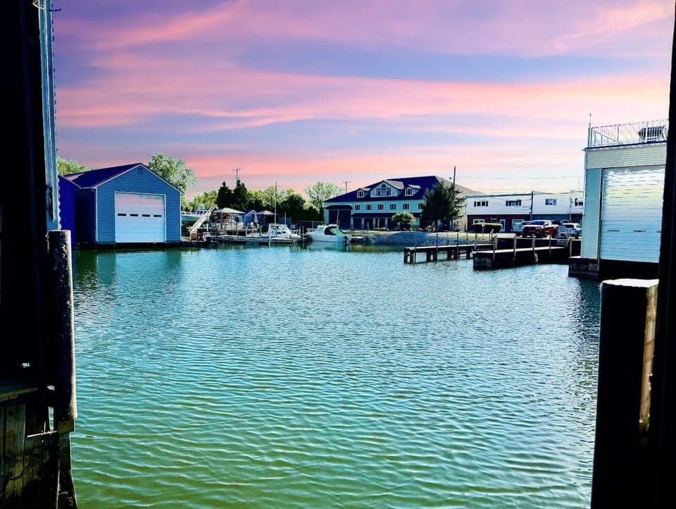 Peaceful Harbor at Sunset
End your day with a breathtaking view of boats and waterfront homes, all under a colorful Lake Erie sunset sky.


