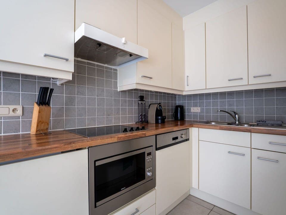 Countertop, Kitchen, Cabinetry, Kitchen Appliance, Flooring, Major Appliance, Interior Design, Wood, Floor, Home Appliance