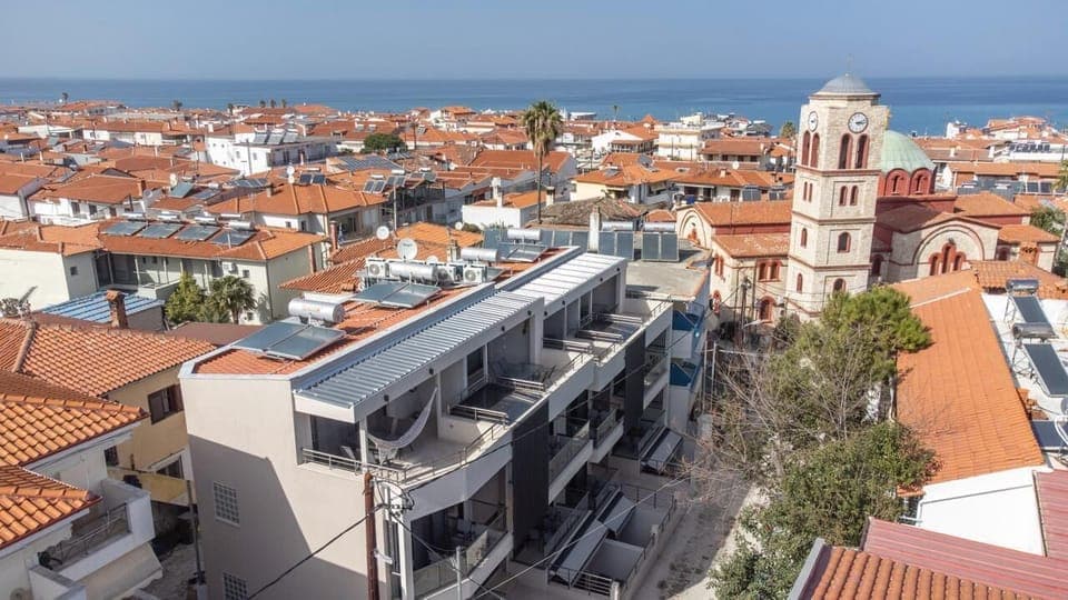 Contemporary Building Exterior – Secure, stylish structure just moments from the beach.

