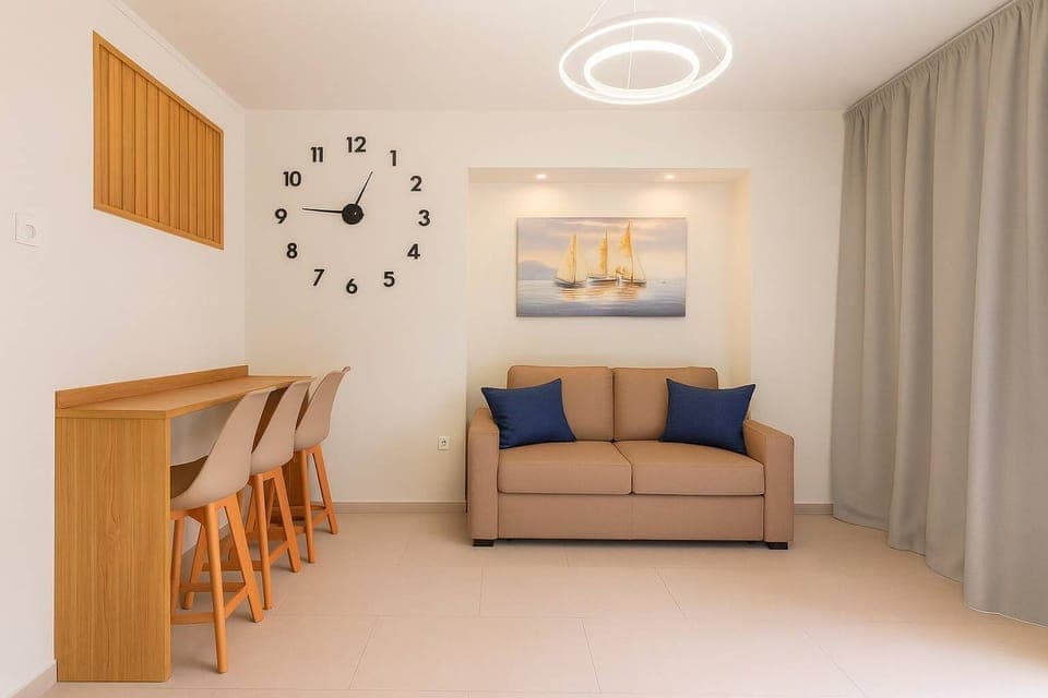 Cozy Living Area with Sofa Bed – Ideal for relaxing or accommodating additional guests.

