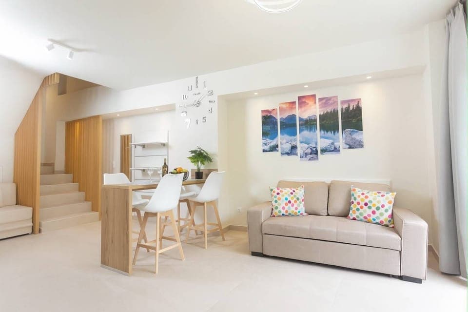 Open-Plan Living Room with Dining Area
Stylish and spacious living area with modern furniture, dining space, and natural lighting.

