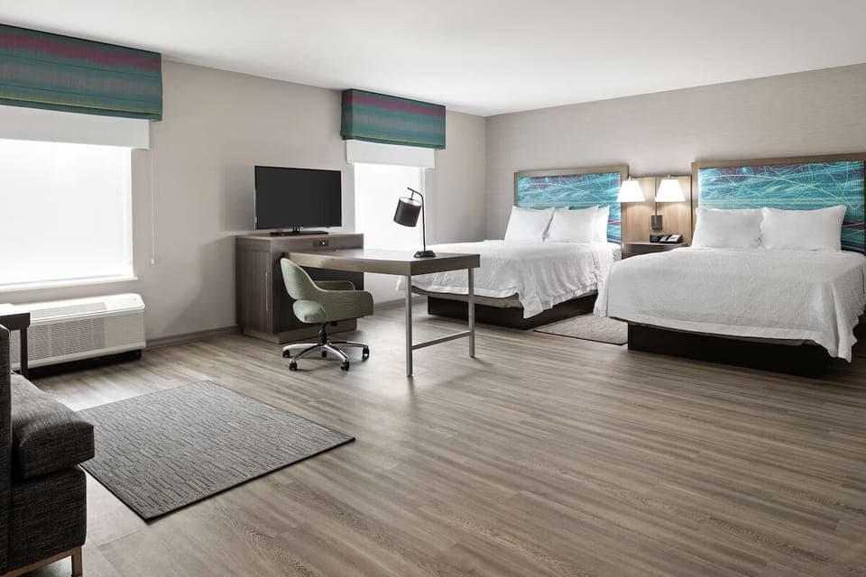 Unwind in a bright, open room with two queen beds.