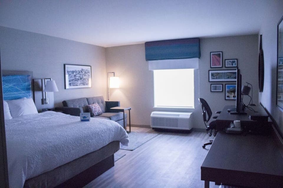 Recharge in a roomy king suite with dedicated workspace.